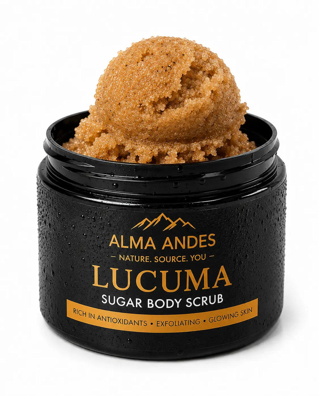 A black jar of Alma Andes Lucuma Sugar Body Scrub with a scoop of the brown sugar scrub visible on top, set against a clean white background.