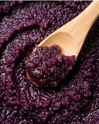Creamy purple açaí sugar scrub with vitamin-rich superfood ingredients