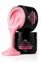 Alma Andes Camu Camu Overnight Glow Cream in a black jar, with one jar tipped over to show a thick, pink, speckled cream dripping out onto a white surface.