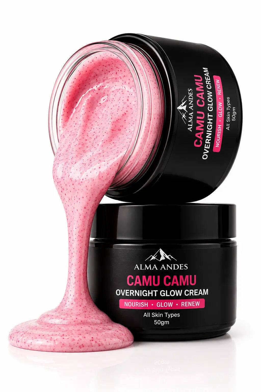 Alma Andes Camu Camu Overnight Glow Cream in a black jar, with one jar tipped over to show a thick, pink, speckled cream dripping out onto a white surface.