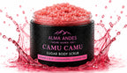 Jar of Camu Camu sugar body scrub with splashing pink liquid on a white background