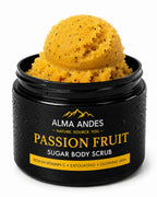 An open black jar of Alma Andes Passion Fruit Sugar Body Scrub, showing a scoop of yellow-orange scrub with small dark specks, on a clean white background.