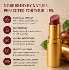 Lip balm with gold casing on a beige background, featuring text about its benefits.