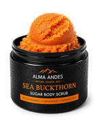 Alma Andes Sea Buckthorn Sugar Body Scrub in a black jar with a scoop of orange scrub visible on top, shown on a white background.
