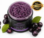 Acai sugar body scrub in a jar with a label, surrounded by acai berries and leaves on a white background.