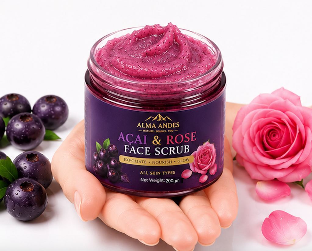 Jar of Acai & Rose Face Scrub held by a hand with purple fruits and pink roses on a white background