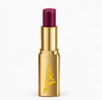 Gold lipstick case with purple lipstick on a white background