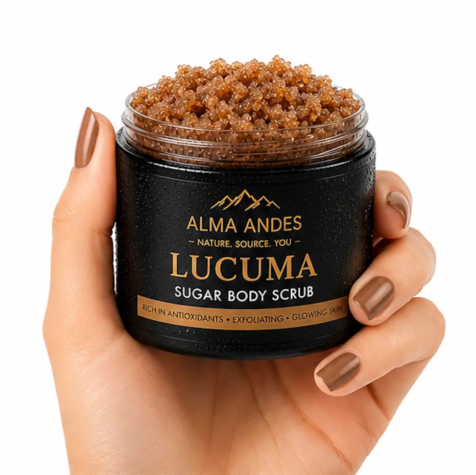 Jar of Lucuma sugar body scrub held by a hand with brown nail polish on a white background